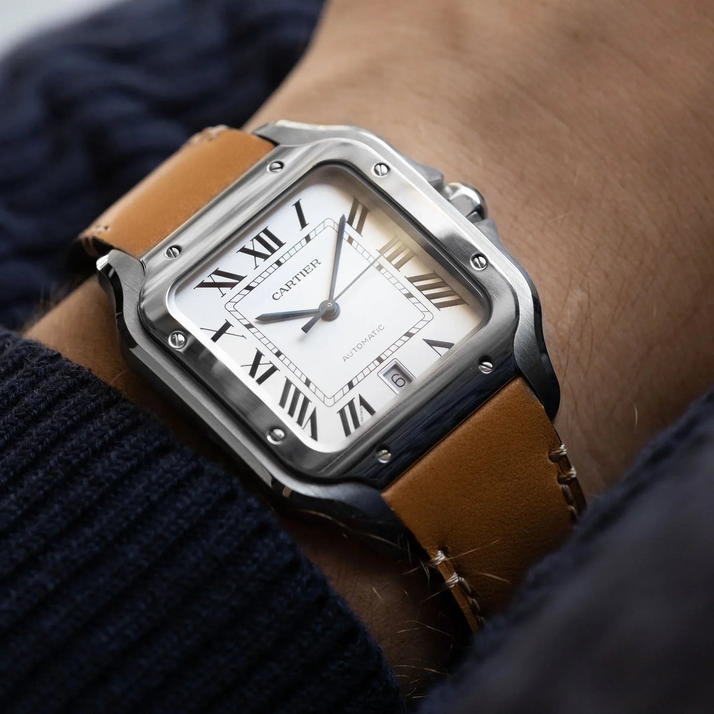 Cartier Santos de Cartier medium model watch with a steel case, silvered opaline dial, and a brown calfskin strap..