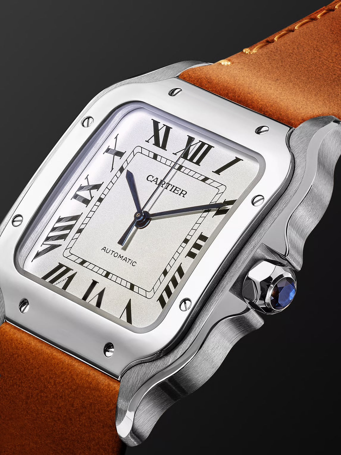 Cartier Santos de Cartier medium model watch with a steel case, silvered opaline dial, and a brown calfskin strap..