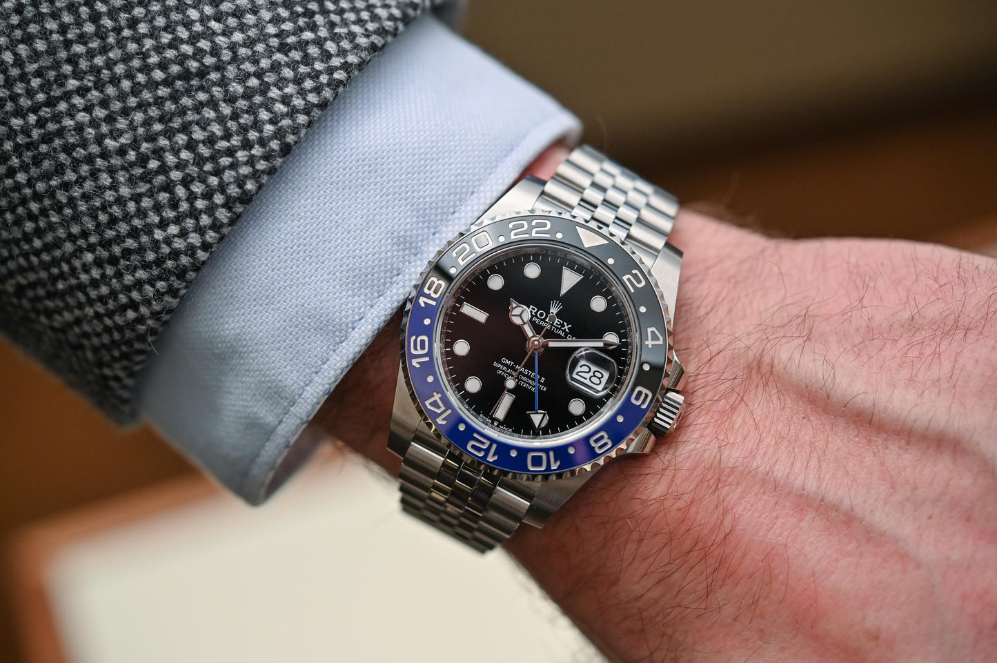 GMT-Master II, also known as the "Batgirl," which features a blue and black Cerachrom bezel and a Jubilee bracelet.