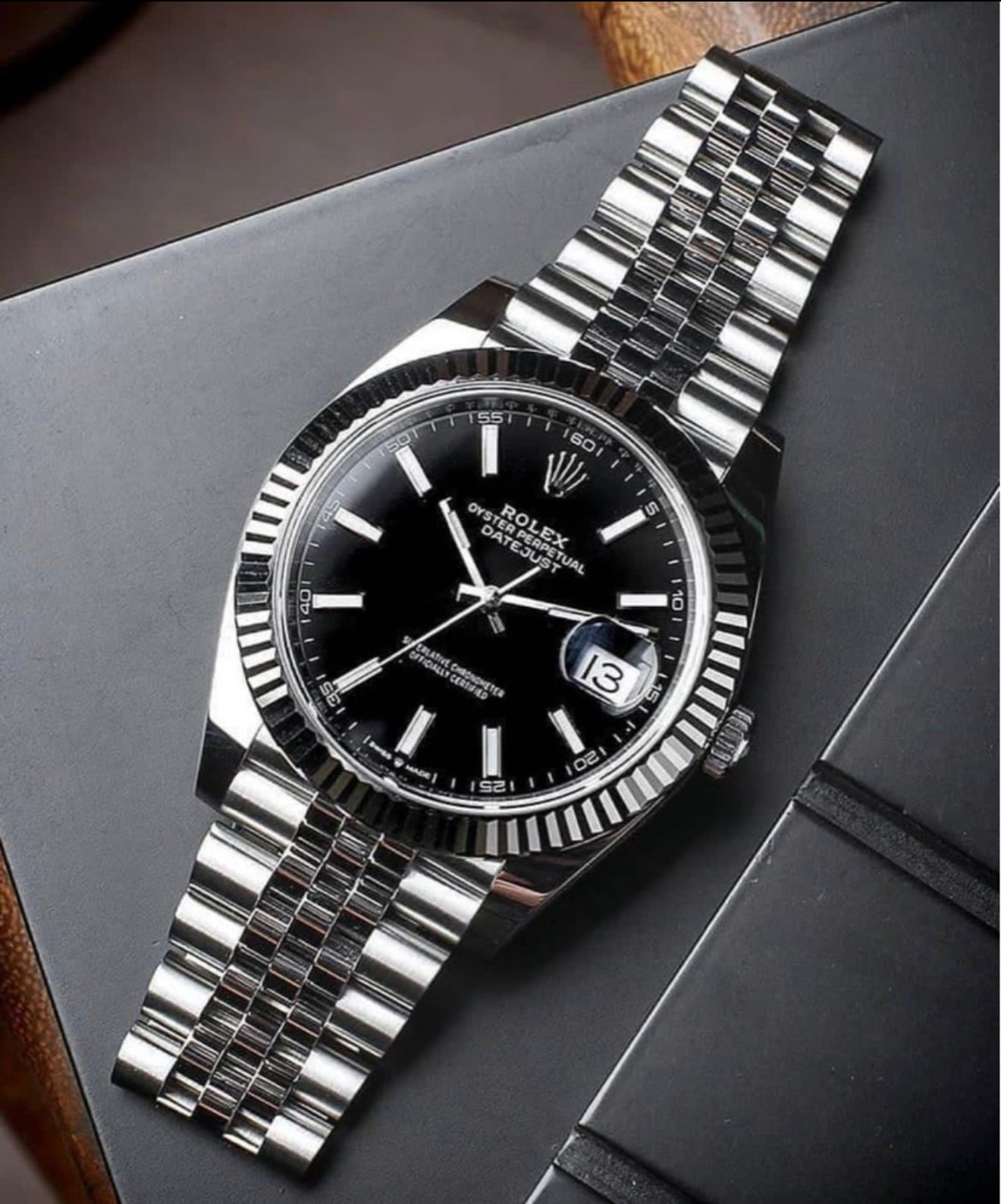 Datejust 41 with a black dial, fluted bezel, and a Jubilee bracelet.