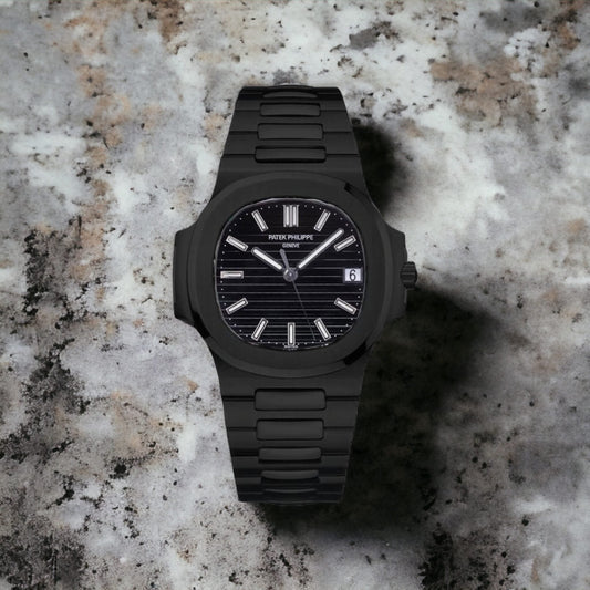 Nautilus watch with a black dial and a black band.