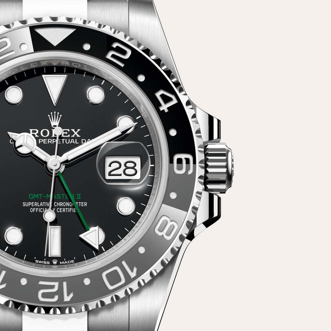 GMT-Master II, also known as the "Bruce Wayne," with a black and grey bezel and a black dial.